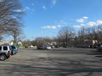 [Before Construction] View of parking lot (looking east) with Hurd Field in the background