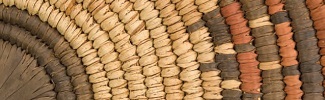 This is a close up photo of a woven basket or other object. 