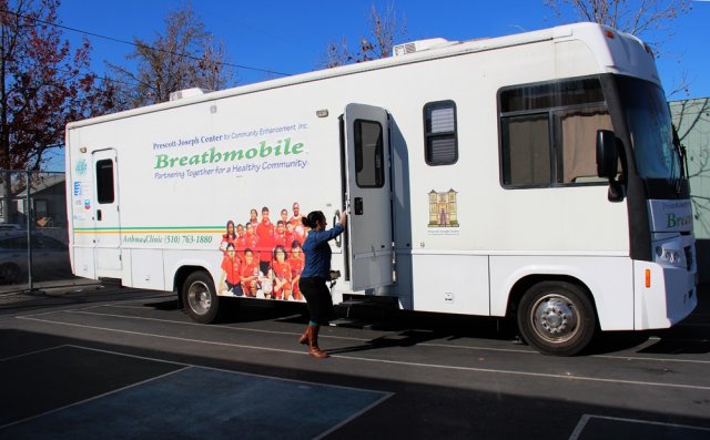 Photo of the Breathmobile, a mobile asthma clinic in a white Recreational Vehicle.