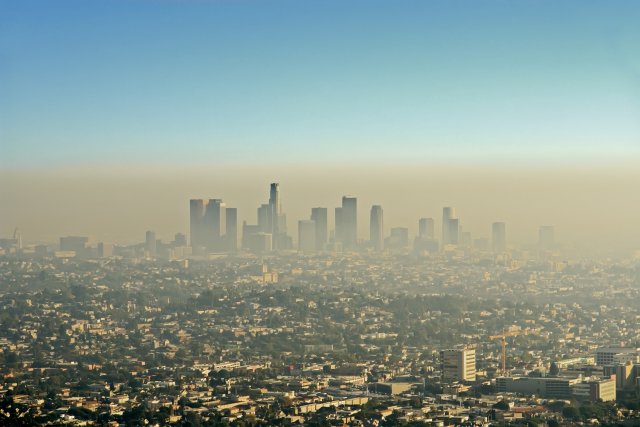 A city skyline enveloped by smog