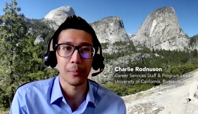 Charlie Rodnuson, wearing heaphones on a video conference call using an image of Yosemite as background.