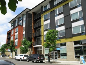 new colorful multifamily housing along a street