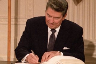 Ronald Reagan signing a law 
