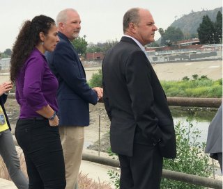 EPA Pacific Southwest Regional Administrator Mike Stoker (in suit) and others tour Taylor Yard River Park.