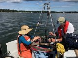 EPA scientists Drs. Donald Cobb (right) and Laura Erban (left) are using the sediment grab tool to collect sediment samples from the Three Bays Estuary in summer of 2019.