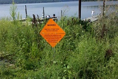 A sign that warns visitors that high levels of cyanobacterial toxins have been detected in the East Fork Reservoir (also known as Harsha Lake), which is a study reservoir located to the east of Cincinnati, OH.