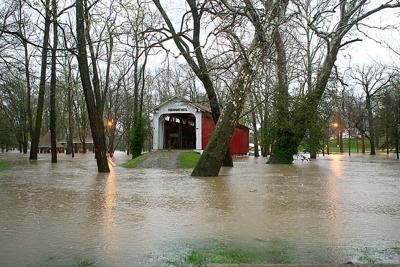 Photograph showing extensive flooding of a park.