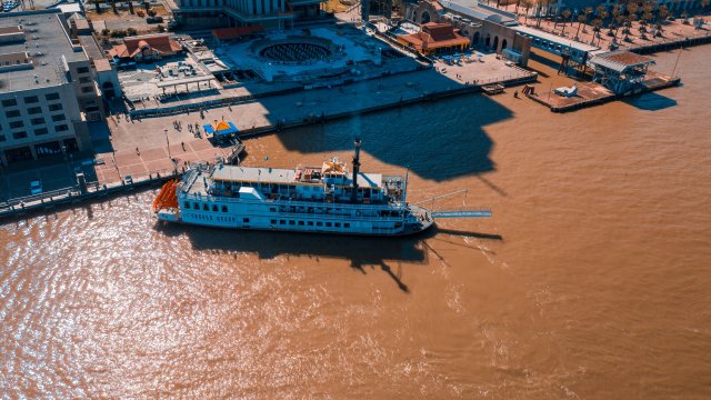 large riverboat leaves the dock
