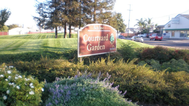 A view of a golf course and sign