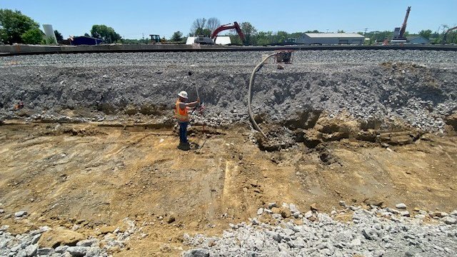 Measuring for depth in an excavated area