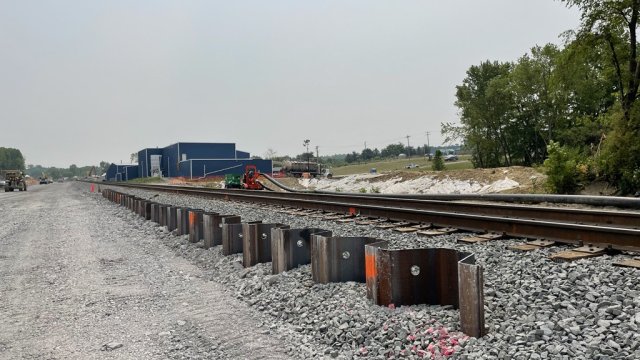 Sheet piling is installed along the south track