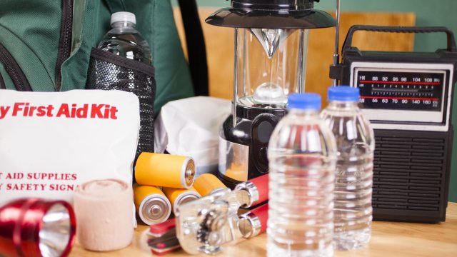 preparedness kit with bottled water, radio, flash light