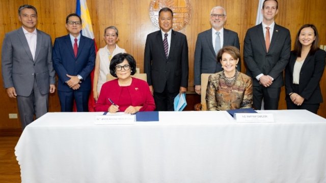 Signing Ceremony with EPA and Philippine Representatives standing behind white table