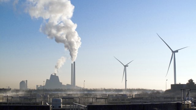 Windmills and industry smoke stacks