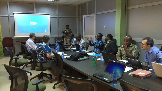 Image of meeting between EPA, Ghana government officials, and others to address local air pollution.