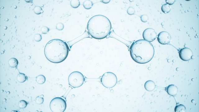 an artistic representation of water molecules on a light blue background