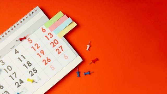 Calendar and pins on table