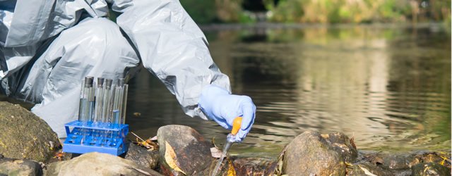 Researcher collecting water samples