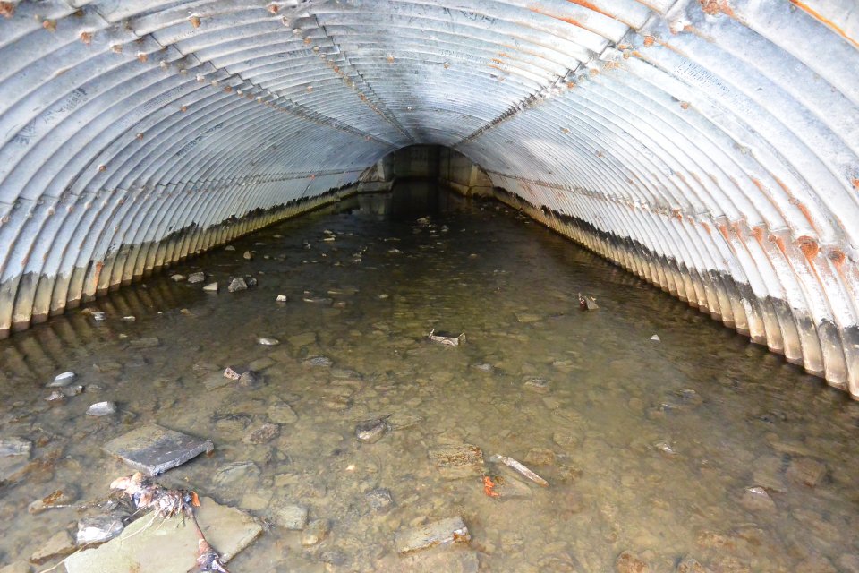 The culvert underneath Liberty Street, where cleaning operations are ongoing but weather dependent