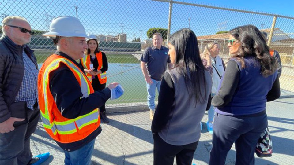 Regional Administrator Martha Guzman with California Department of Toxic Substances Control staff in orange vests at the former Exide battery recycling facility.