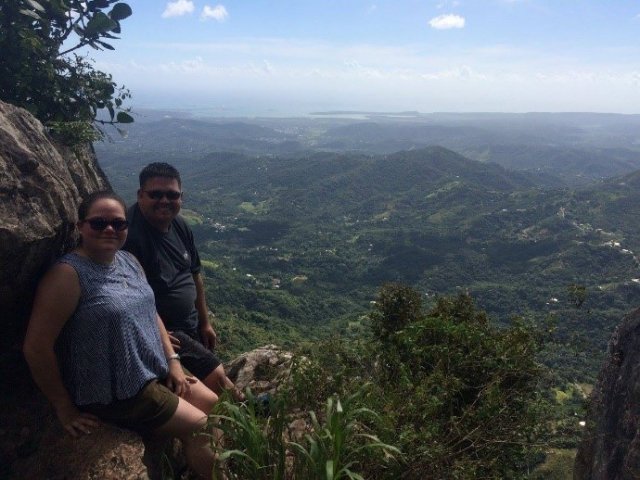 Hiking El Rodadero Peak in Yauco, Puerto Rico. You can see the Caribbean Sea at the distance.