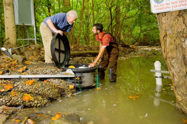 Don Brown, EPA Employee and Sean Tyler, EPA Summer Student, check stream supply pump for Experimental Streams Facility.