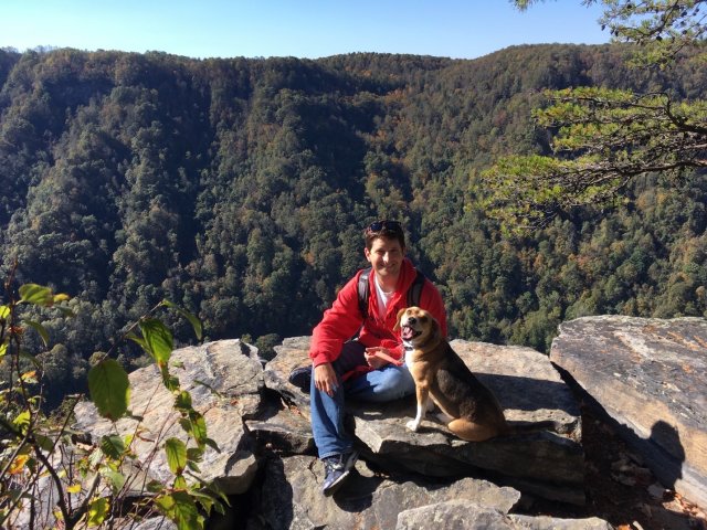 Stephen (back left) and his dog Brynn (front right) take a break from hiking in the West Virginia mountains.