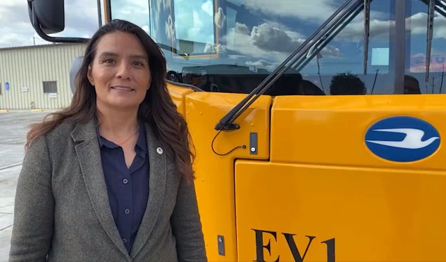 EPA Regional Administrator Martha Guzman in front of a new clean school bus in Modesto, California.