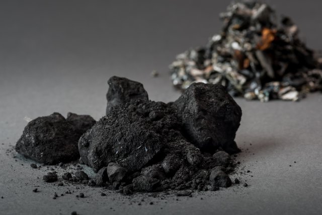 This is a picture of black mass, a granular material made up of the shredded cathodes and anodes of the batteries.