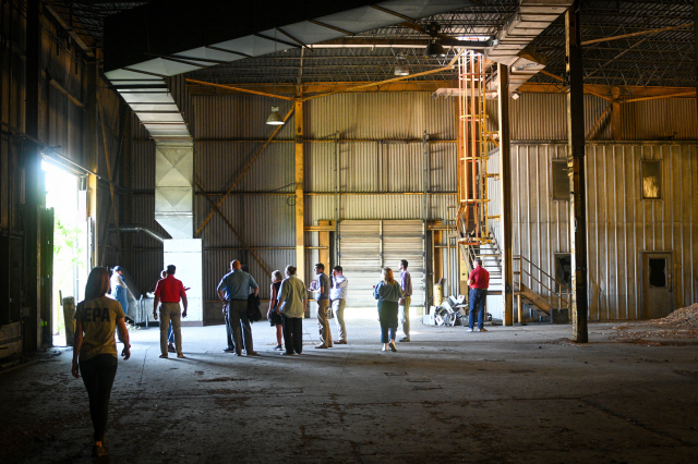 Group inside huge abandoned warehouse