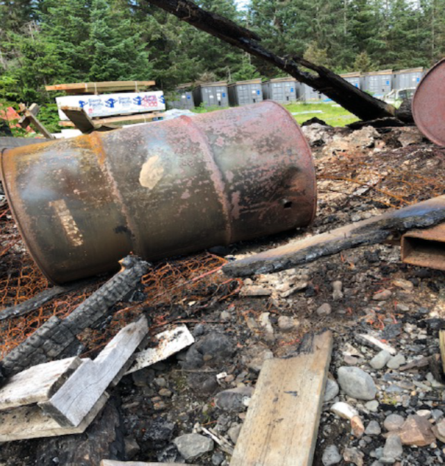 deteriorated 55 gallon drum at illegal dump site