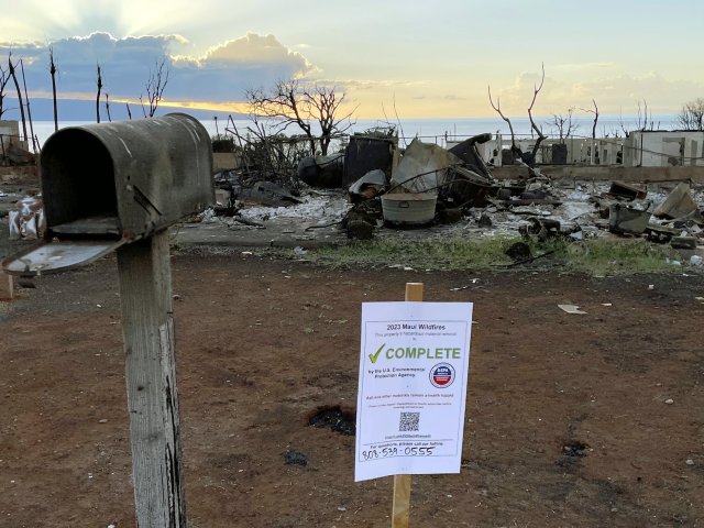 Sign placed on properties in Maui that have completed Household Hazardous Waste Removal. Sign includes: EPA Emergency Response logo, QR Code to Hawaii DOH, and a phone number for questions. Text reads: "2023 Maui Wildfires = This property's Household Hazardous Waste removal is COMPLETE. Ash and other materials remain a health hazard. Please go to Hawai'i DOH (QR Code) before entering. 
