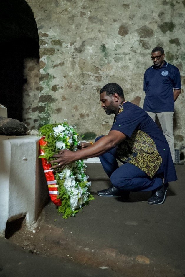 Administrator Regan lays a wreath in the dungeons to honor the enslaved people held at Cape Coast Castle.   January 28, 2024 