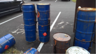 Drums of hazardous waste abandoned in parking lots outside apartment complexes in Columbus, OH 