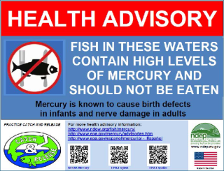 Sign that reads: HEALTH ADVISORY - FISH IN THESE WATERS CONTAIN HIGH LEVELS OF MERCURY AND SHOULD NOT BE EATEN. Mercury is known to cause birth defects in infants and nerve damage in adults. More information online.