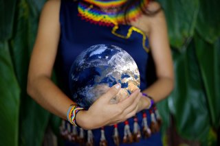 this is a picture of a girl holding a globe