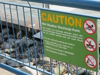 Sign cautioning about wet weather discharge into sewer