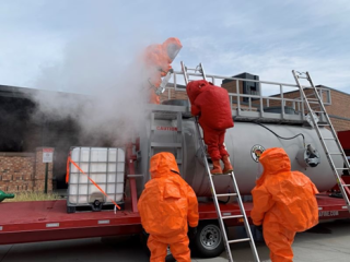 DFD emergency responders perform a drill wearing Level A chemical protection suits. (Photo Credit: Denver Fire Department) 