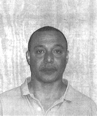 black and white copy of a middle-aged hispanic male with short hair
