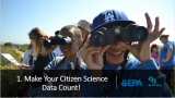 A group of kids participating in citizen science with binoculars outdoors 