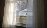 an image of an open window with blinds