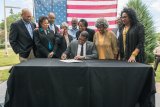 Administrator Regan signing into existence the new Office of Environmental Justice and External Civil Rights