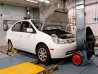 vehicle is tested in a dynamometer test cell