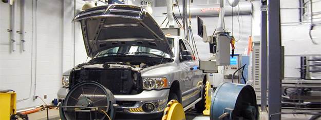a truck undergoing emissions testing in a lab