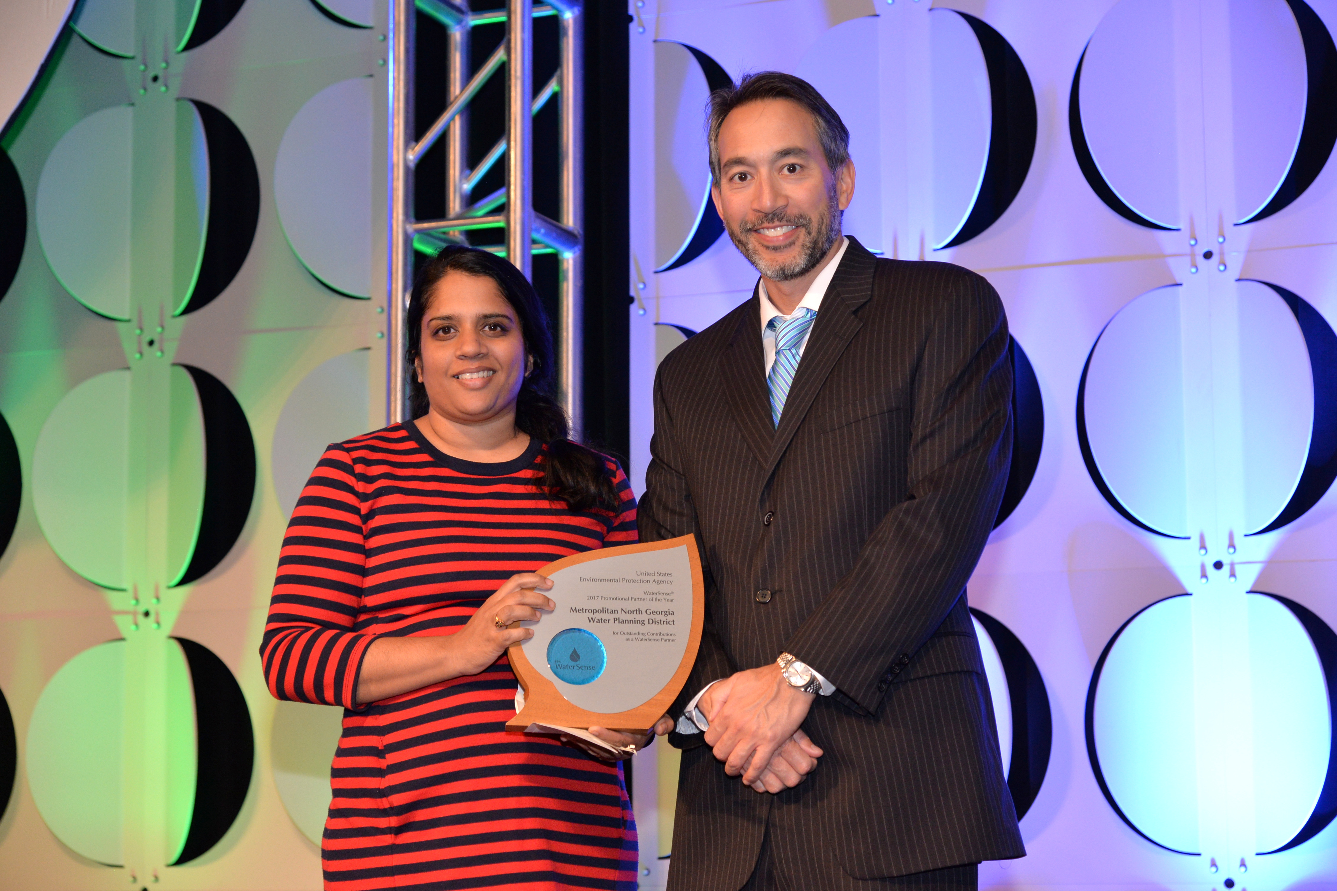Neela Ram accepts Promotional Partner of the Year Award for Metropolitan North Georgia Water Planning District.
