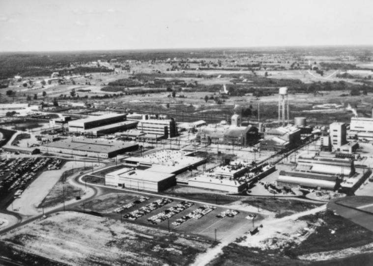 Black and white aerial photo of the former facility and quarry location