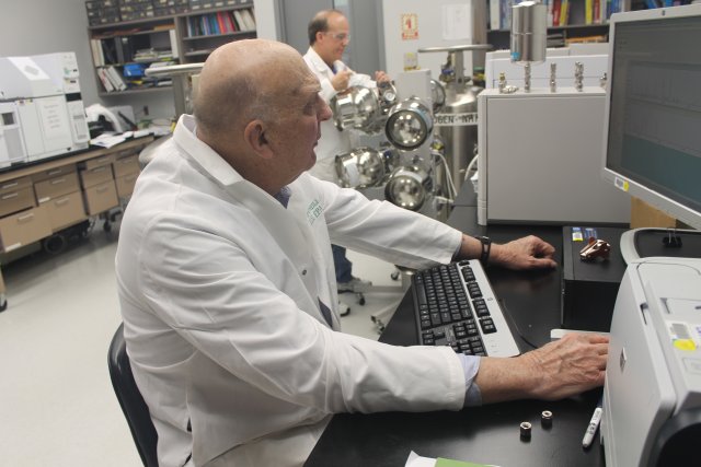 Chemists analyzing air toxic samples.