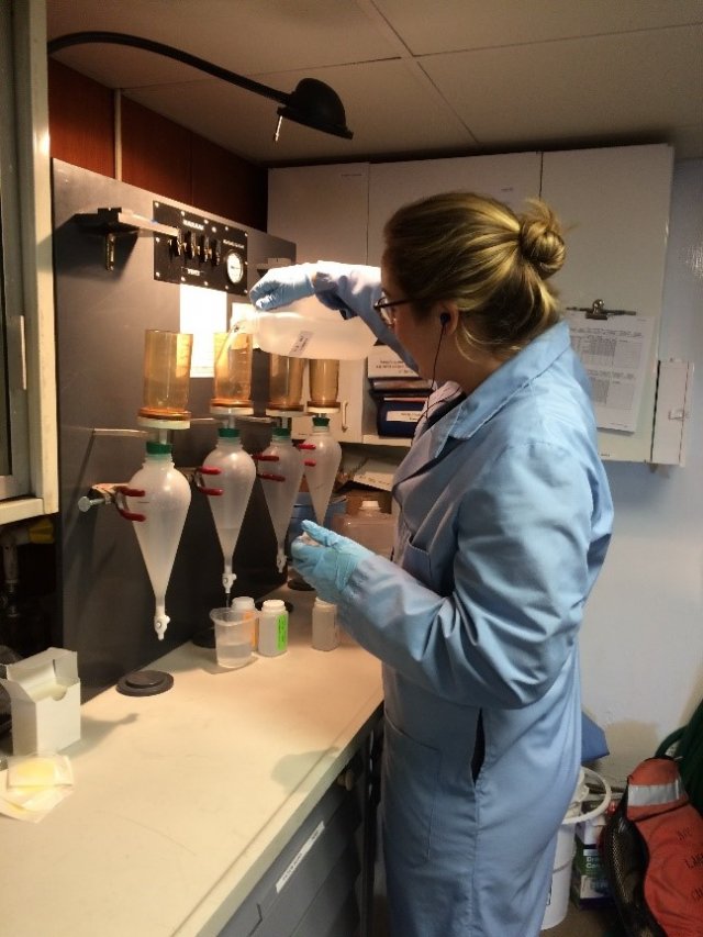 An EPA scientist filters raw water samples in the "wet" laboratory onboard the R/V Lake Guardian.