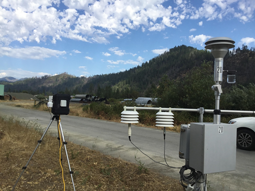 Low-cost sensor package (left) and reference monitor (right) deployed in Happy Camp, CA.