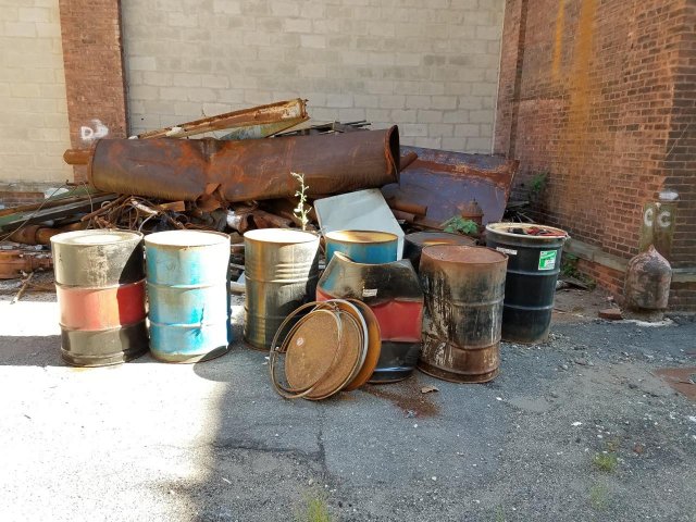 Rusted drums at the Vo-Toys site.